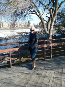 Jackie in front of the power generating waterfall right dwontown 