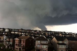 Dark sky and funnel cloud over the city at 1pm.