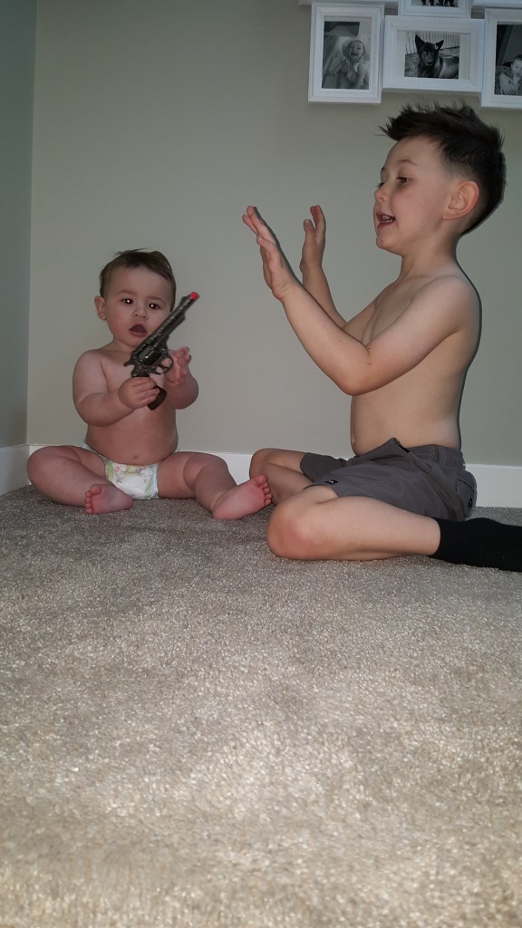 These kids are cute !!! August and Jackson playing cops and robbers 