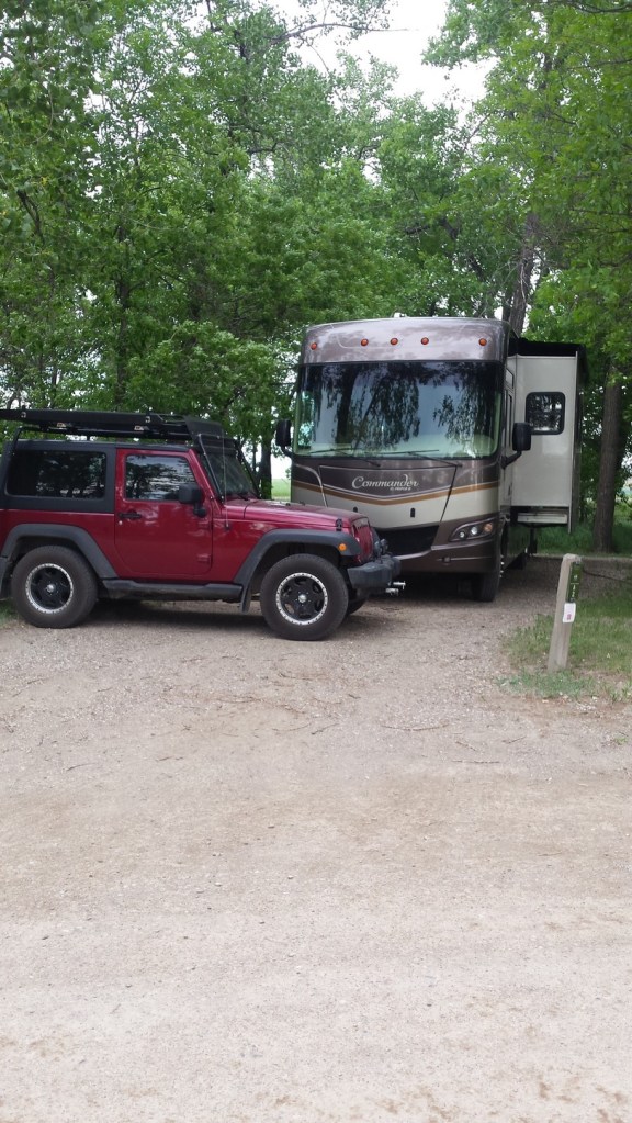 Jeep and blue tarp for wind protection 