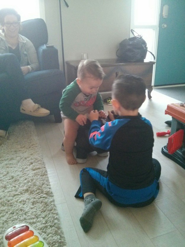 Jackson and August playing ride the cow.